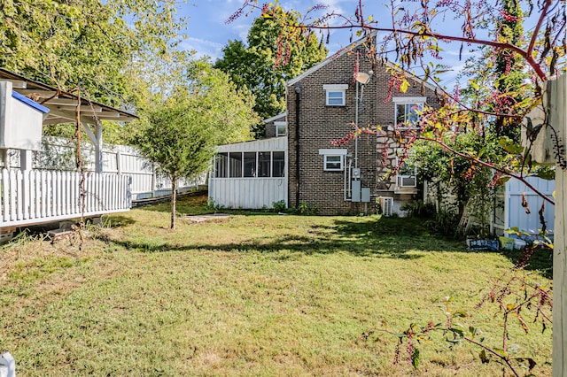 view of yard featuring a sunroom