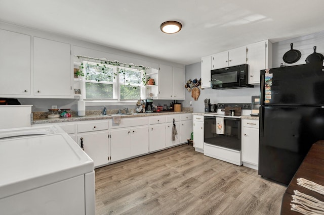 315 Gilliland Rd SE, Cleveland, TN 37311 - kitchen with black appliances, open shelves, white cabinetry, light wood-style flooring, and light countertops