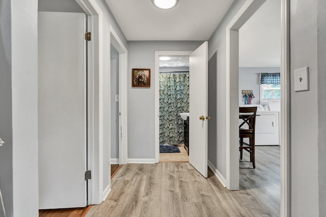 315 Gilliland Rd SE, Cleveland, TN 37311 - hall featuring light wood-style flooring and washer / clothes dryer