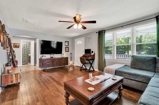 315 Gilliland Rd SE, Cleveland, TN 37311 - living room with arched walkways, a ceiling fan, and hardwood / wood-style flooring