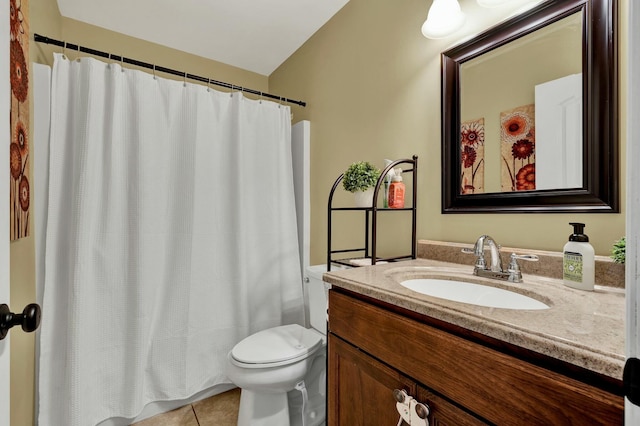 bathroom with tile patterned floors, a shower with shower curtain, toilet, and vanity