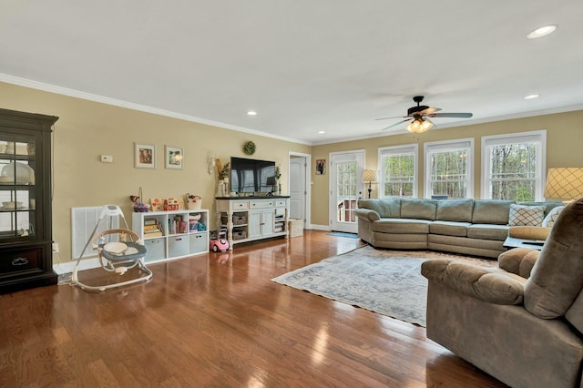 living room featuring visible vents, ceiling fan, ornamental molding, wood finished floors, and recessed lighting