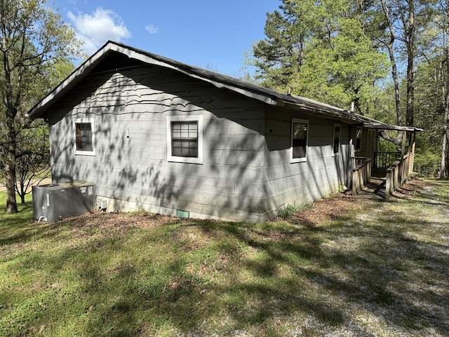 view of property exterior featuring a lawn and crawl space