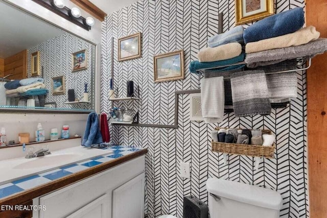 bathroom with vanity and toilet