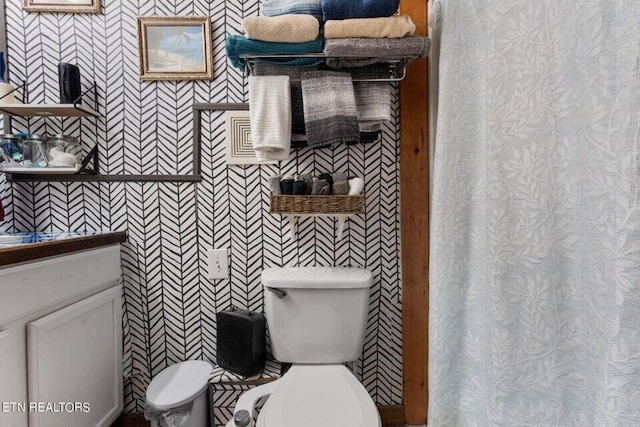 bathroom featuring vanity and toilet