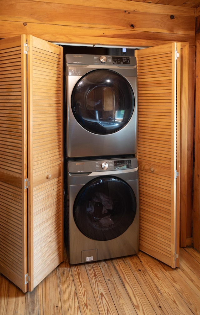 11249 Possum Trail Rd, Harrison, TN 37341 - washroom featuring stacked washing machine and dryer and light wood-style floors