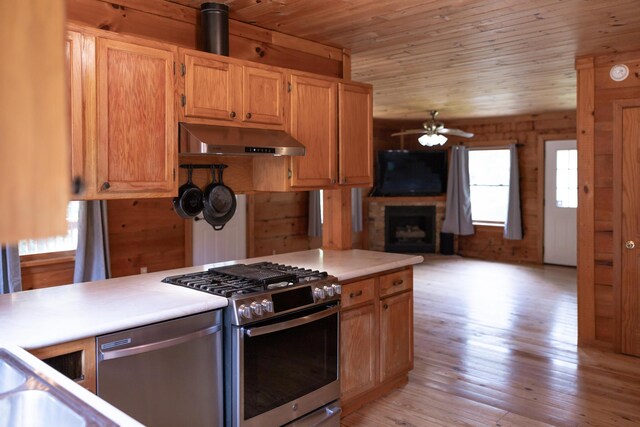 11249 Possum Trail Rd, Harrison, TN 37341 - kitchen with appliances with stainless steel finishes, extractor fan, a ceiling fan, wooden ceiling, and a large fireplace
