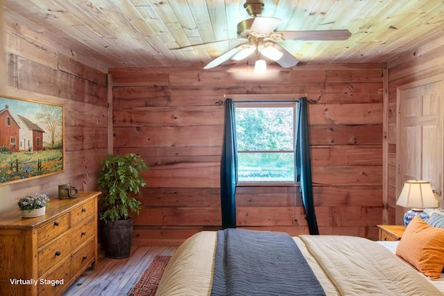 11249 Possum Trail Rd, Harrison, TN 37341 - bedroom with wooden walls, wood ceiling, and light wood-style floors
