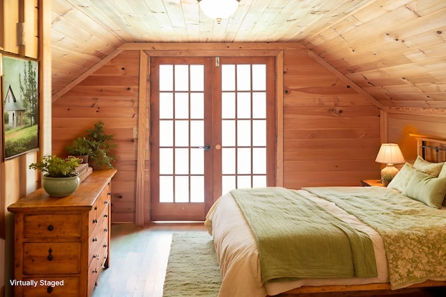 11249 Possum Trail Rd, Harrison, TN 37341 - bedroom featuring wood ceiling, wood walls, vaulted ceiling, wood finished floors, and french doors
