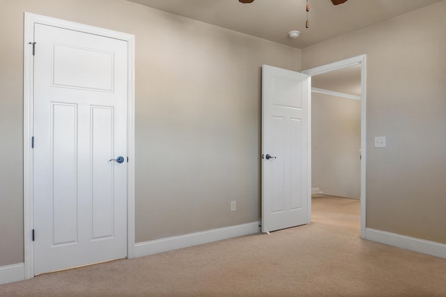 unfurnished bedroom featuring ceiling fan