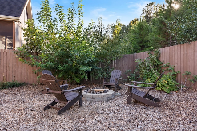 view of yard with a fire pit