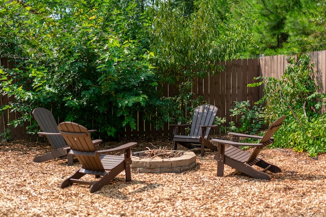 view of yard with an outdoor fire pit