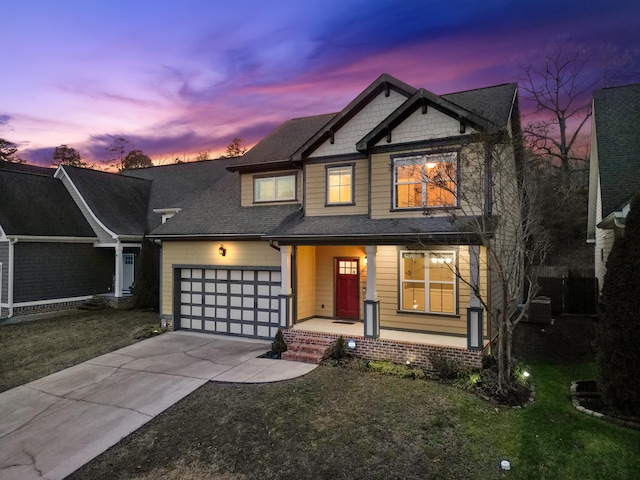 view of front of home featuring a yard and a garage