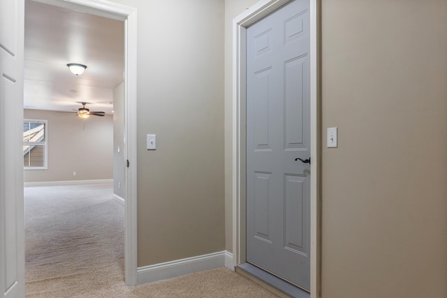 hallway with light carpet