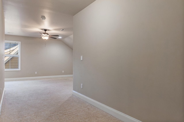 additional living space featuring light carpet, vaulted ceiling, and ceiling fan