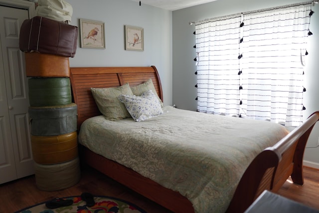 bedroom with wood finished floors