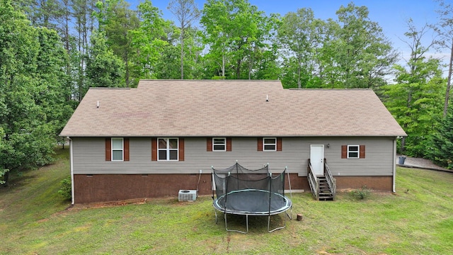 140 Croft Chapel Rd, Turtletown, TN 37391 - rear view of house with a trampoline, a yard, a shingled roof, and crawl space