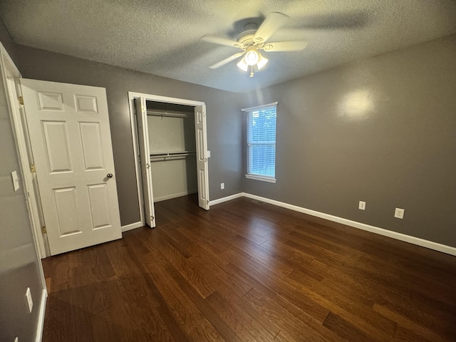 140 Croft Chapel Rd, Turtletown, TN 37391 - unfurnished bedroom featuring dark wood-style flooring, a textured ceiling, a closet, baseboards, and ceiling fan
