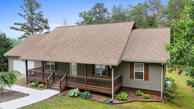 140 Croft Chapel Rd, Turtletown, TN 37391 - cape cod-style house featuring a garage, covered porch, and a shingled roof