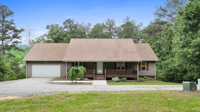140 Croft Chapel Rd, Turtletown, TN 37391 - cape cod-style house featuring a porch, driveway, a garage, a front yard, and a shingled roof