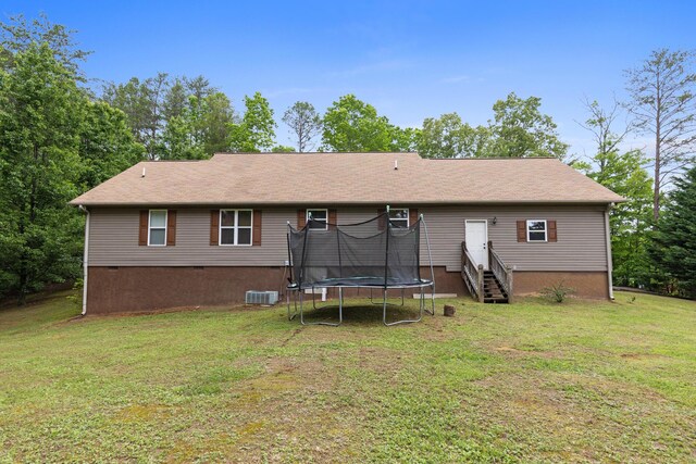 140 Croft Chapel Rd, Turtletown, TN 37391 - rear view of property featuring a trampoline, entry steps, a lawn, crawl space, and central AC
