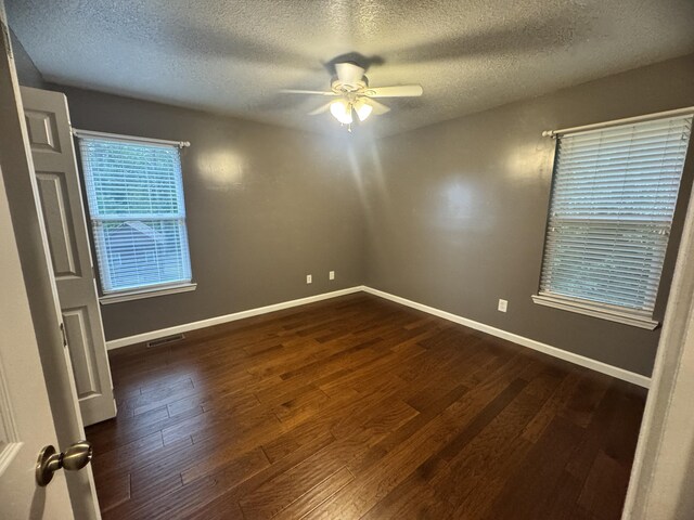 140 Croft Chapel Rd, Turtletown, TN 37391 - spare room with a textured ceiling, a ceiling fan, dark wood-style flooring, and baseboards