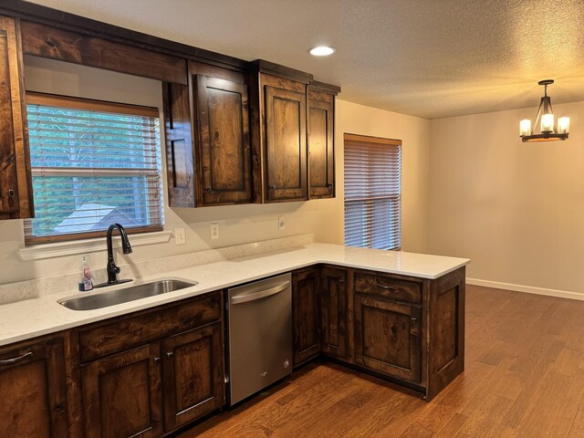140 Croft Chapel Rd, Turtletown, TN 37391 - kitchen featuring stainless steel dishwasher, a sink, a peninsula, dark brown cabinetry, and dark wood finished floors