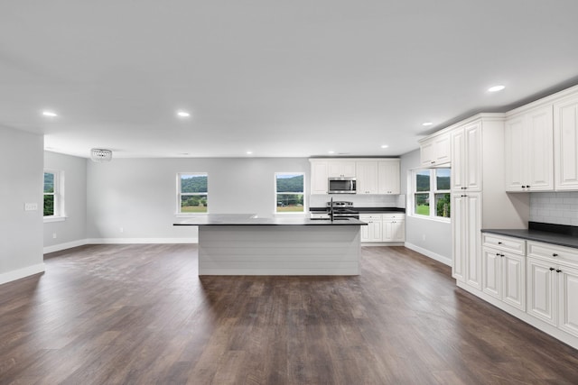 2517 No Pone Rd NW, Georgetown, TN 37336 - kitchen with stainless steel appliances, dark countertops, plenty of natural light, dark wood-style floors, and recessed lighting