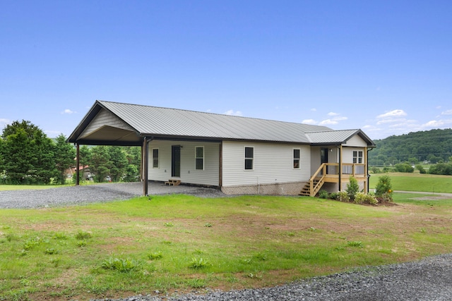 2517 No Pone Rd NW, Georgetown, TN 37336 - view of front of property with driveway, a front lawn, an attached carport, and a metal roof