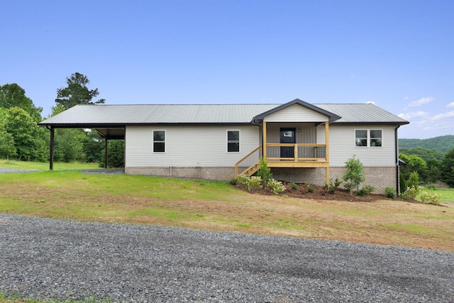 2517 No Pone Rd NW, Georgetown, TN 37336 - view of front of property featuring a metal roof, a front yard, and a carport