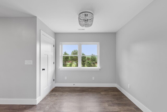 2517 No Pone Rd NW, Georgetown, TN 37336 - unfurnished room with a chandelier and wood finished floors