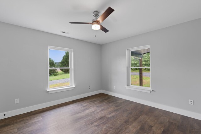 2517 No Pone Rd NW, Georgetown, TN 37336 - spare room with plenty of natural light, a ceiling fan, and dark wood finished floors