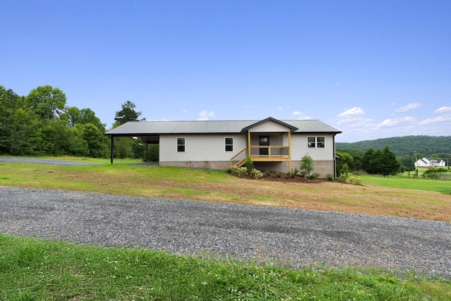 2517 No Pone Rd NW, Georgetown, TN 37336 - view of front of home with a metal roof, a front lawn, and an attached carport