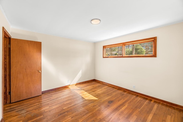 spare room featuring hardwood / wood-style floors