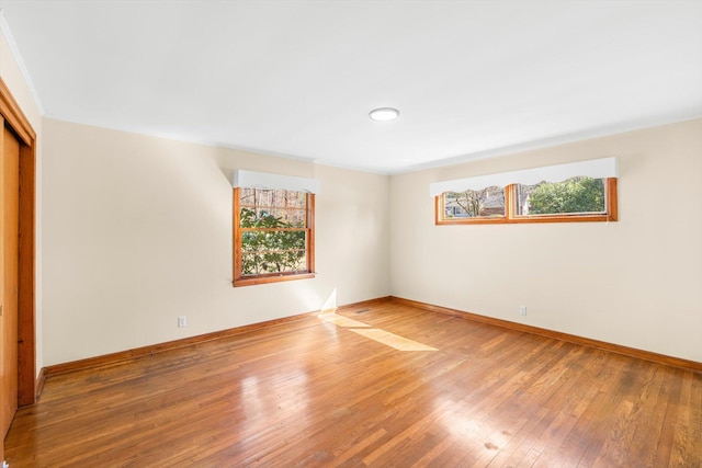 empty room featuring wood-type flooring