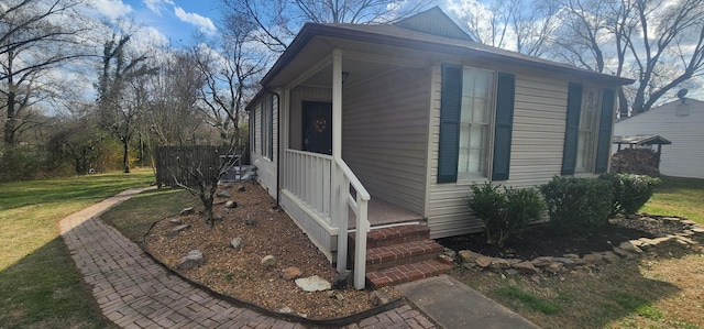 view of side of home featuring a yard