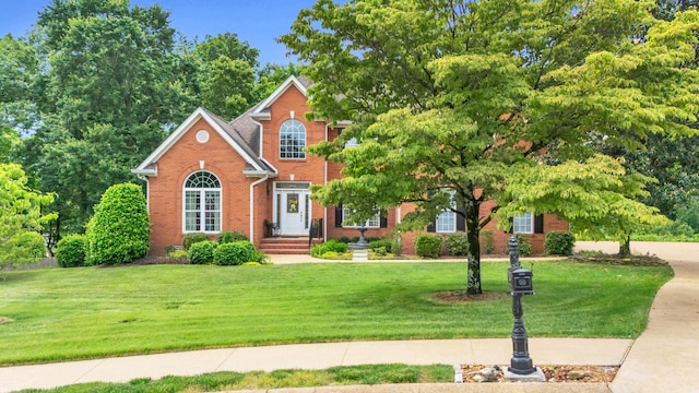 1028 Ivy Manor Ct, Hixson, TN 37343 - view of front facade with brick siding and a front lawn