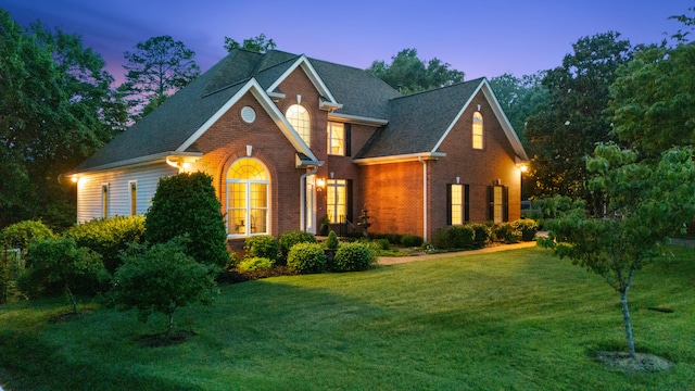 1028 Ivy Manor Ct, Hixson, TN 37343 - view of front of home featuring brick siding, a lawn, and a shingled roof