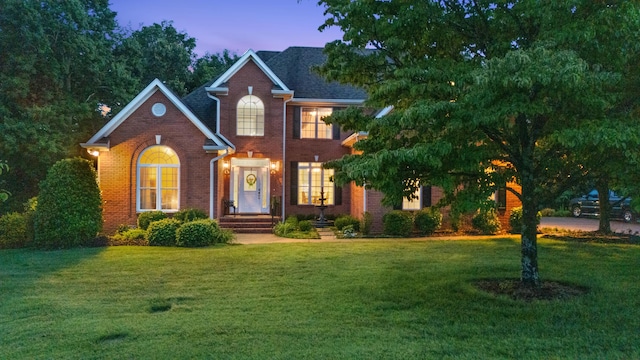 1028 Ivy Manor Ct, Hixson, TN 37343 - view of front of house with brick siding and a yard