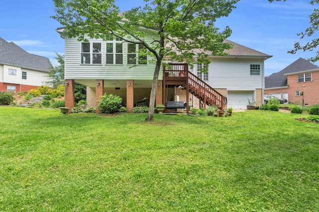 1028 Ivy Manor Ct, Hixson, TN 37343 - back of property with a garage, a yard, stairway, and a wooden deck