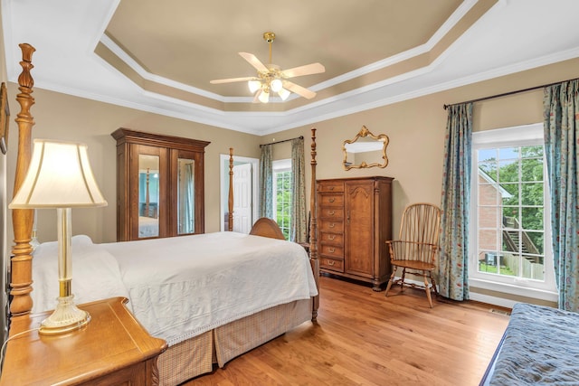1028 Ivy Manor Ct, Hixson, TN 37343 - bedroom with a raised ceiling, multiple windows, light wood finished floors, crown molding, and a ceiling fan