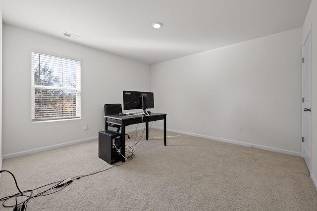 office featuring baseboards, visible vents, and carpet flooring