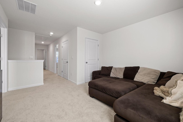 living room featuring recessed lighting, light carpet, visible vents, baseboards, and attic access