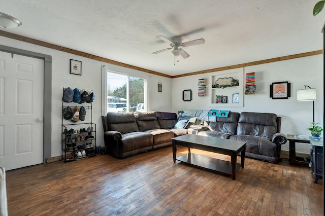 living room with a textured ceiling, ceiling fan, and dark hardwood / wood-style floors