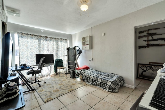 tiled bedroom with a textured ceiling