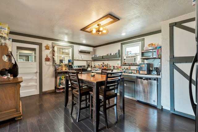 dining area featuring dark hardwood / wood-style floors, an AC wall unit, and a textured ceiling