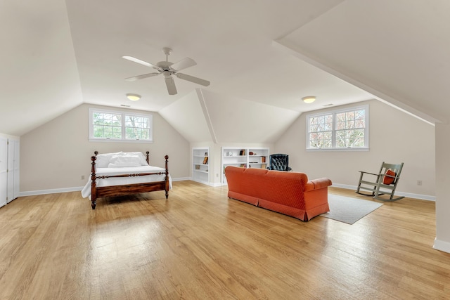 bedroom featuring vaulted ceiling, baseboards, light wood-type flooring, and ceiling fan