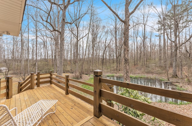 wooden terrace with a view of trees