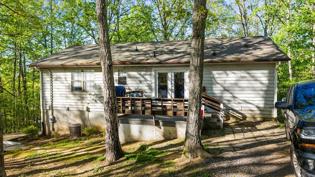 exterior space featuring french doors and central AC unit
