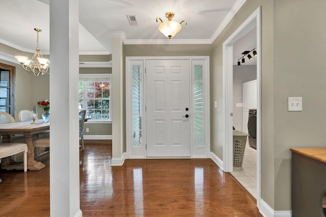 1010 Bradford Pl, Cohutta, GA 30710 - foyer entrance with a chandelier, ornamental molding, wood finished floors, and baseboards